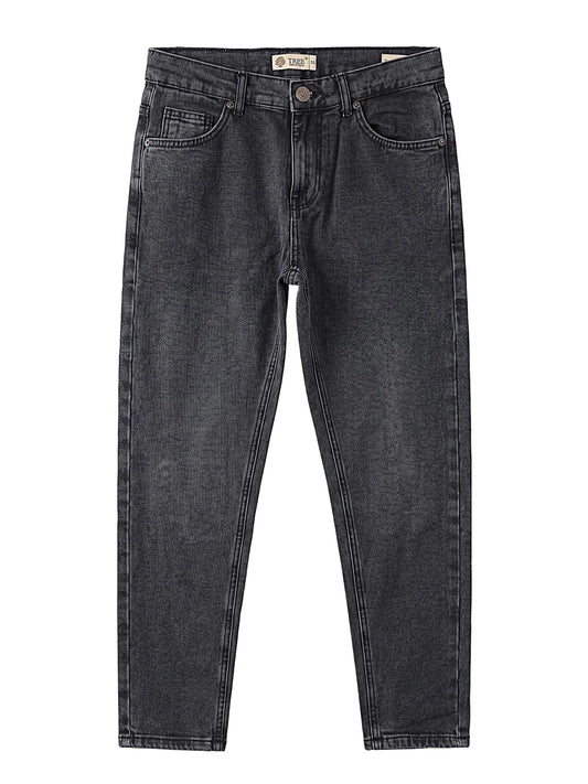 Front view of a model wearing men's boyfriend fit jeans in a classic wash by TREE.