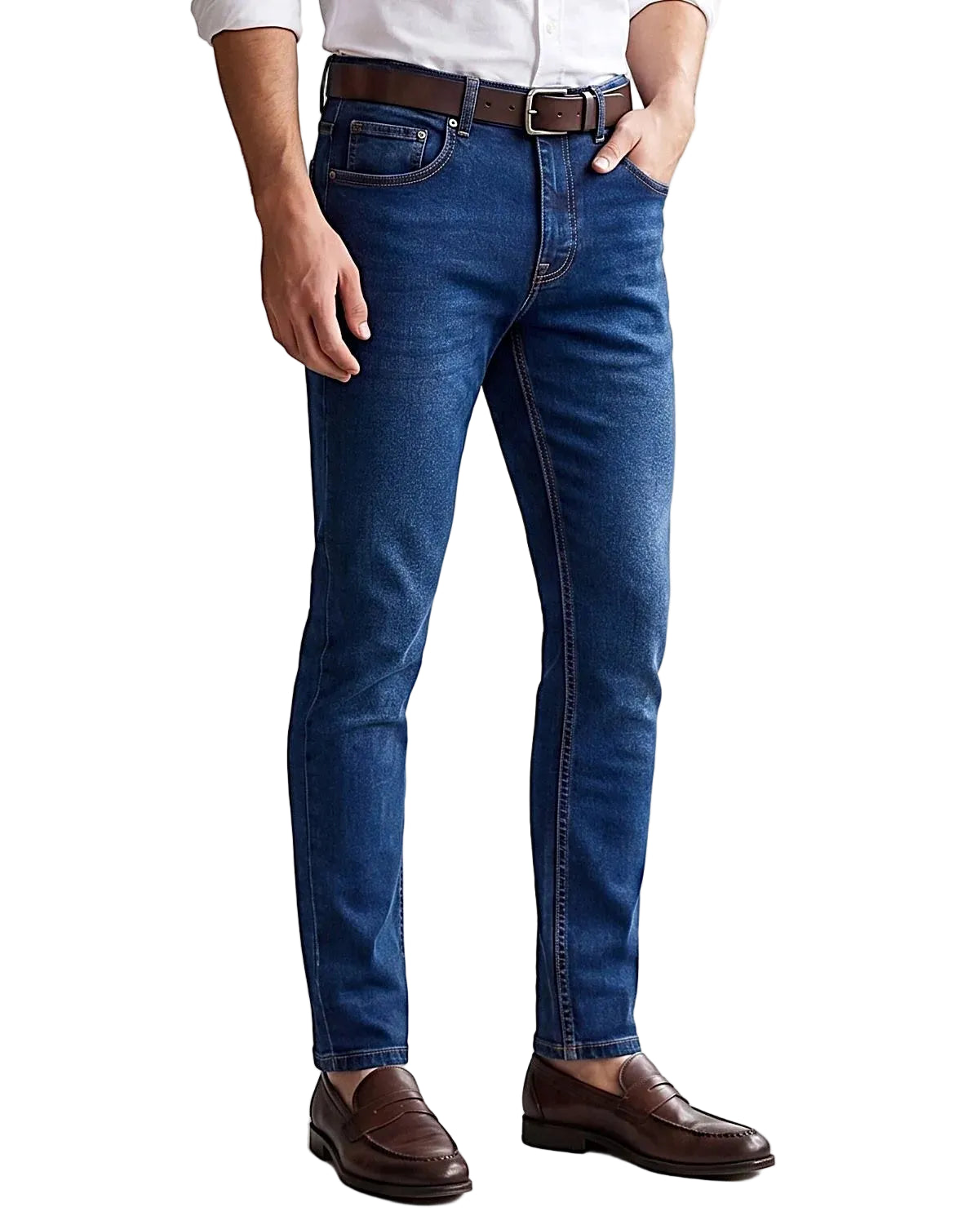 Front view of a model wearing men's slim fit jeans in a classic wash by TREE.