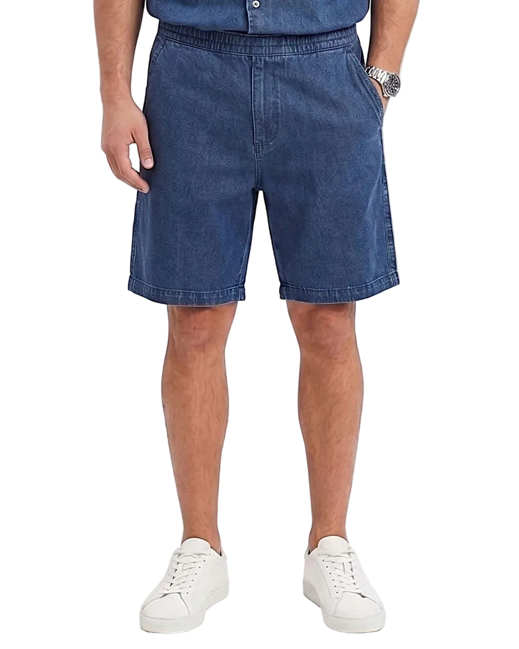 Front view of a model wearing men's 100% cotton denim shorts with an elastic waist by TREE.