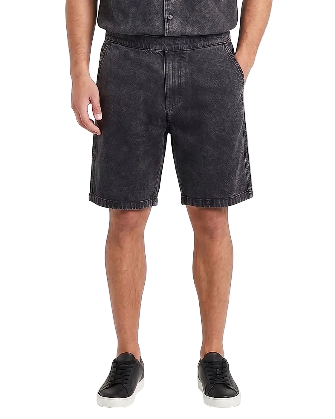Front view of a model wearing men's 100% cotton denim shorts with an elastic waist by TREE.