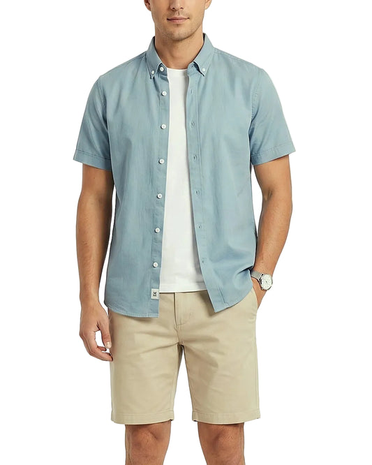 Front view of a model wearing a men's summer 100% cotton short-sleeve shirt by TREE.