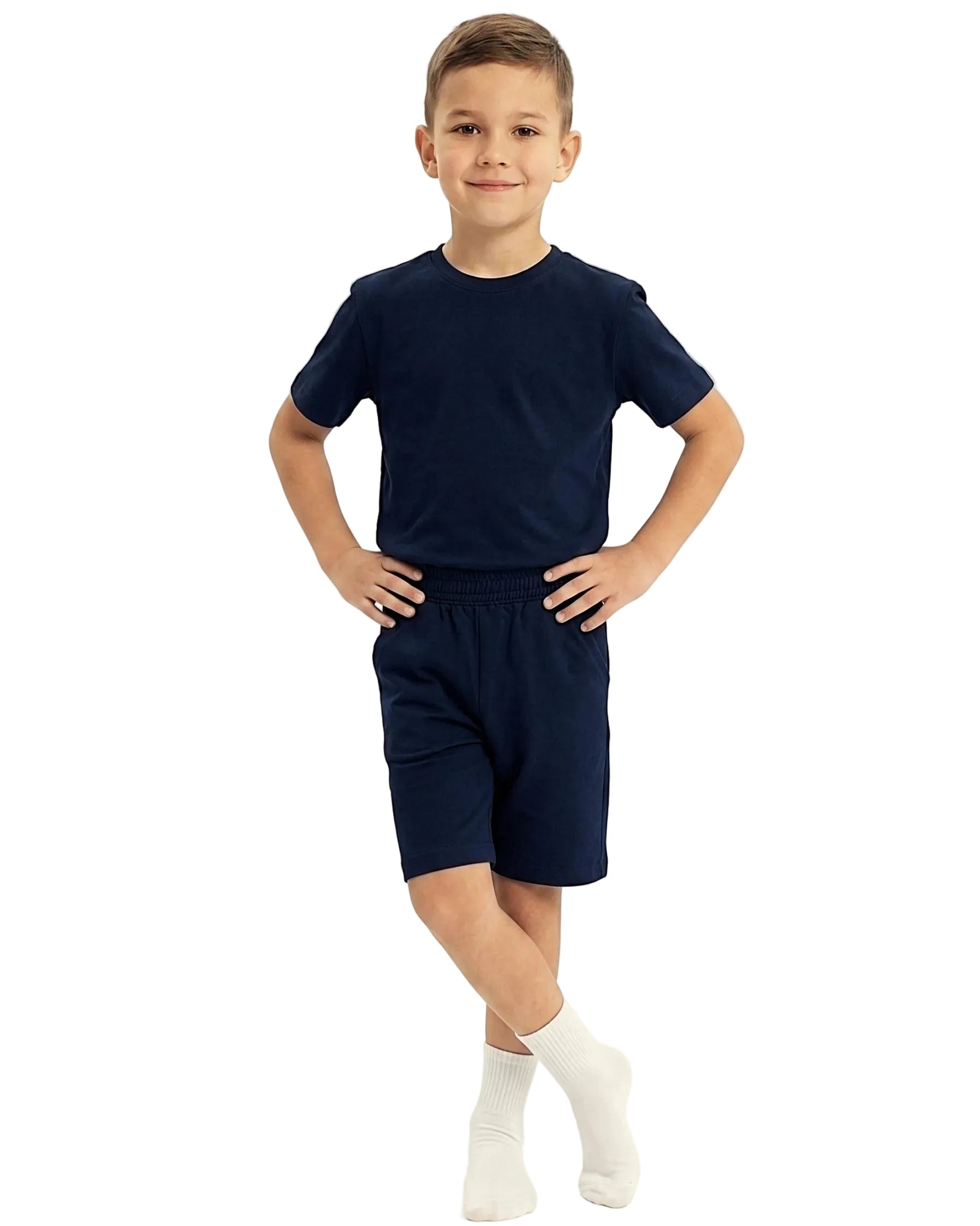 Front view of a boy wearing a kids' summer 100% cotton t-shirt and shorts outfit set by TREE.