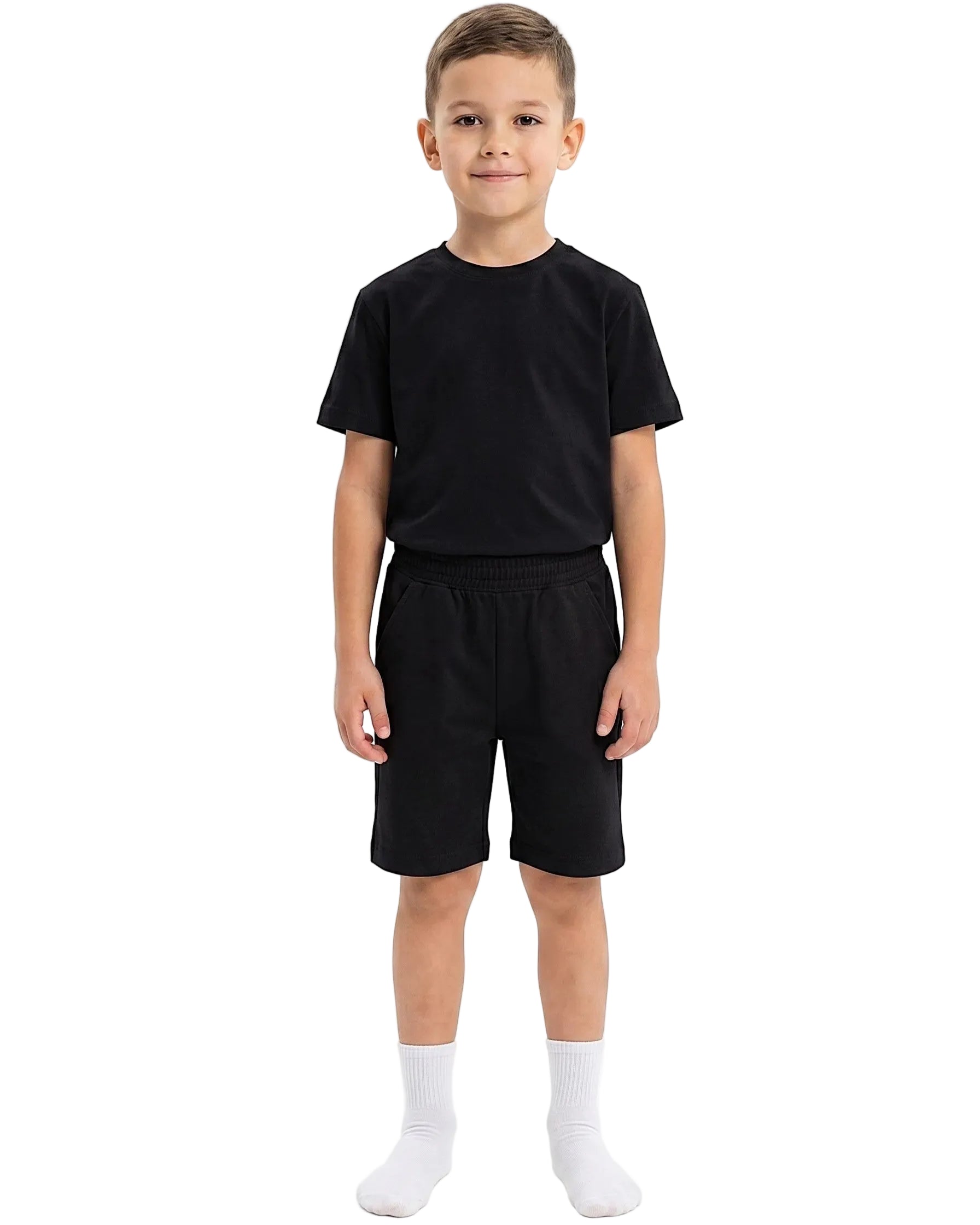 Front view of a boy wearing a kids' summer 100% cotton t-shirt and shorts outfit set by TREE.