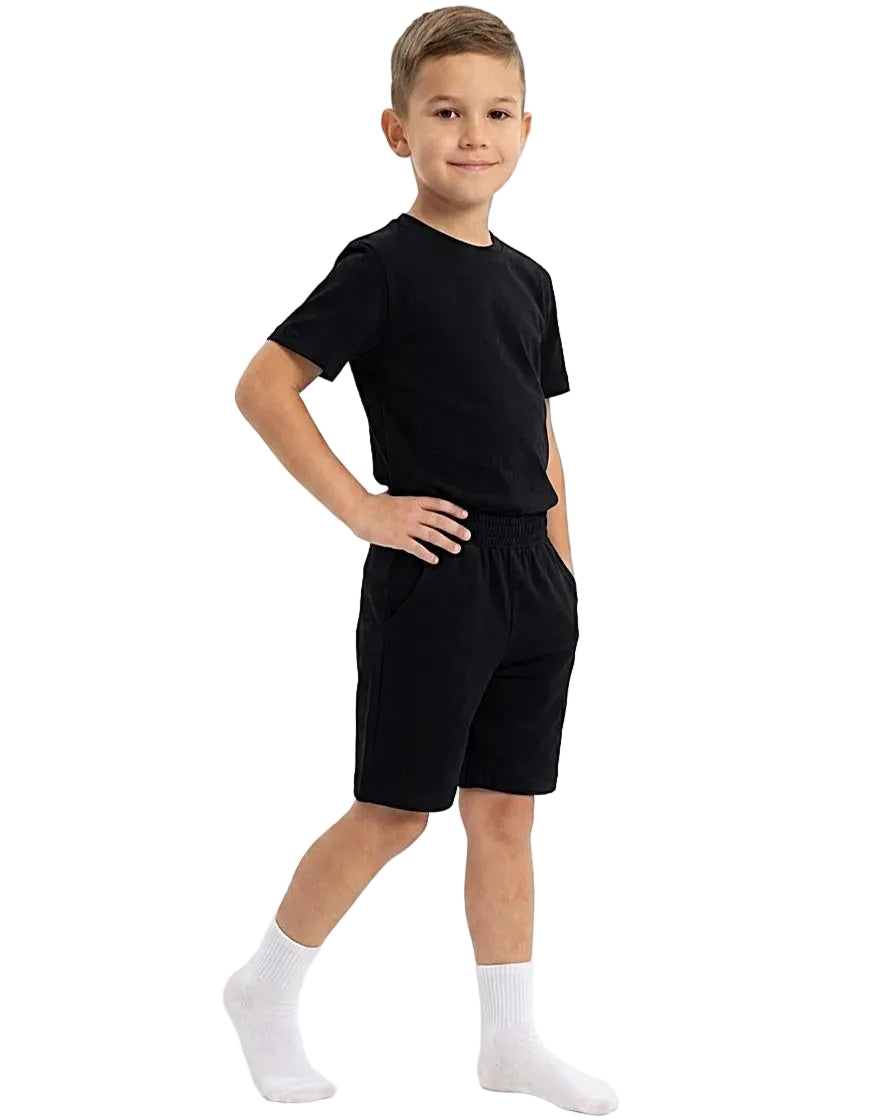 Front view of a boy wearing a kids' summer 100% cotton t-shirt and shorts outfit set by TREE.