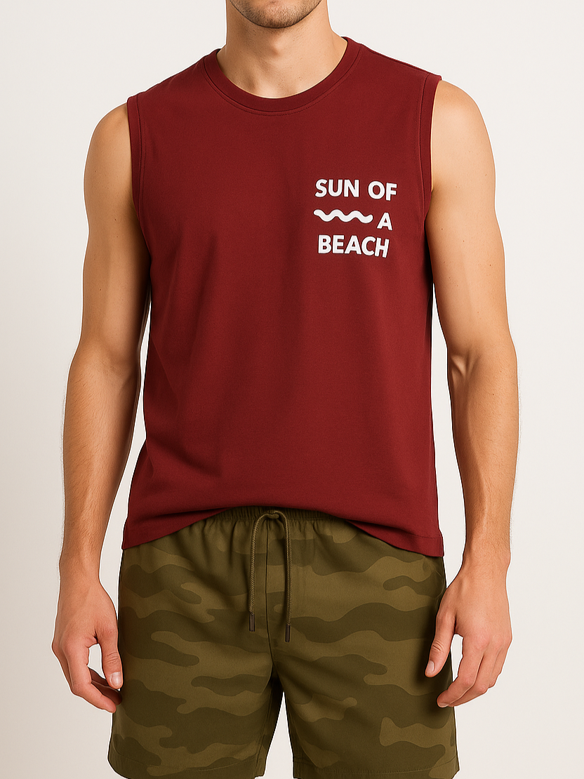 Person wearing a maroon sleeveless shirt with 'Sun of a Beach' text and green camouflage shorts on a plain background
