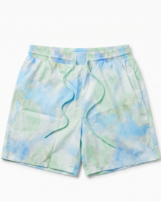 Tie-dye shorts with blue and green pattern on a white background