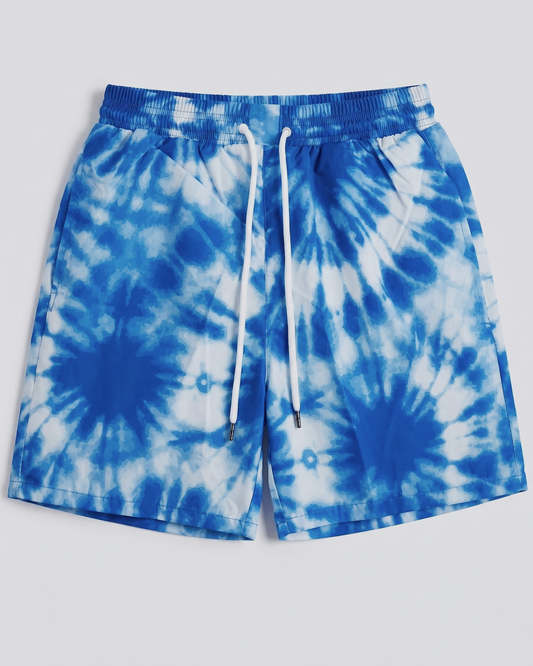 Blue and white tie-dye shorts on a light gray background