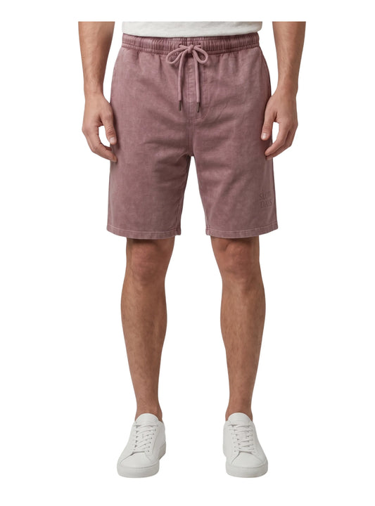 Front view of a man wearing faded burgundy casual summer shorts with an elastic drawstring waist by TREE