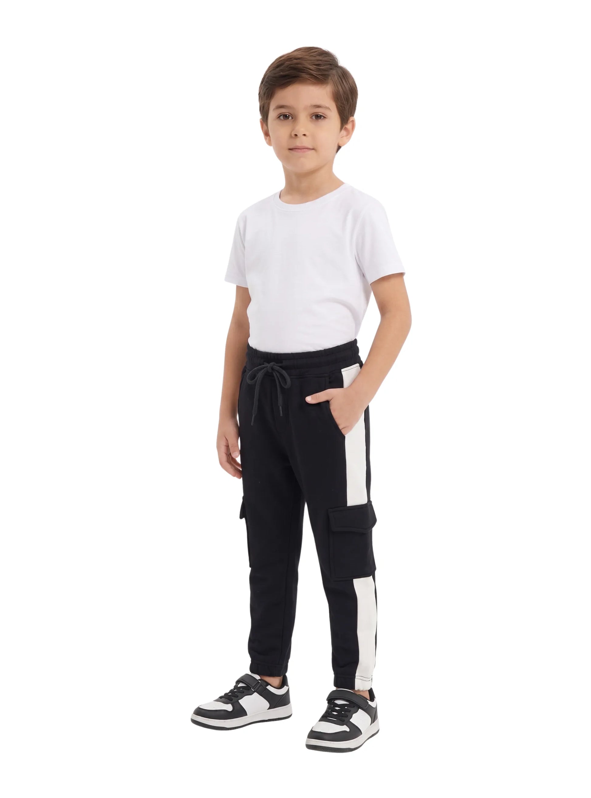 Close-up of the cargo pockets and white side stripes on TREE's boys' black sweatpants