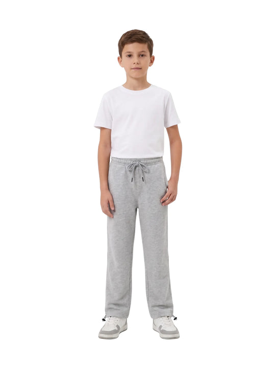 Young boy wearing TREE light grey straight-fit sweatpants with elastic drawstring waist
