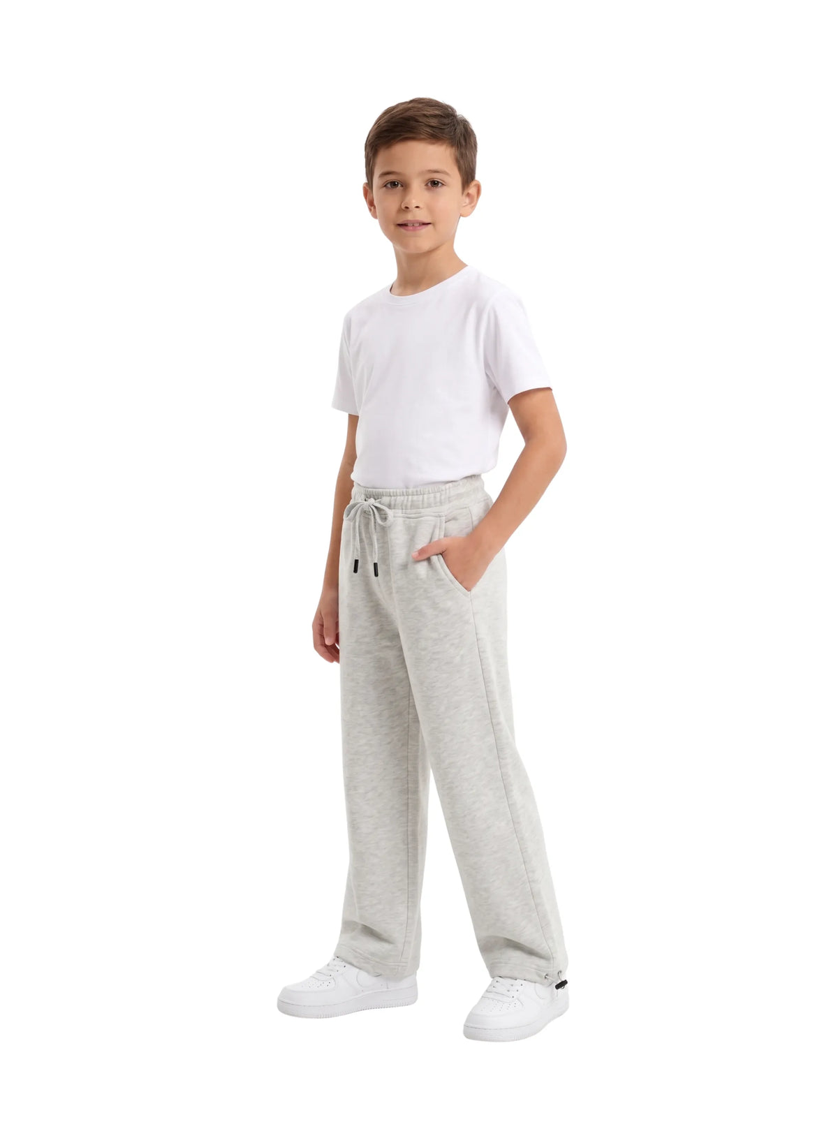 Young boy wearing TREE light grey wide-leg sweatpants with drawstring waist