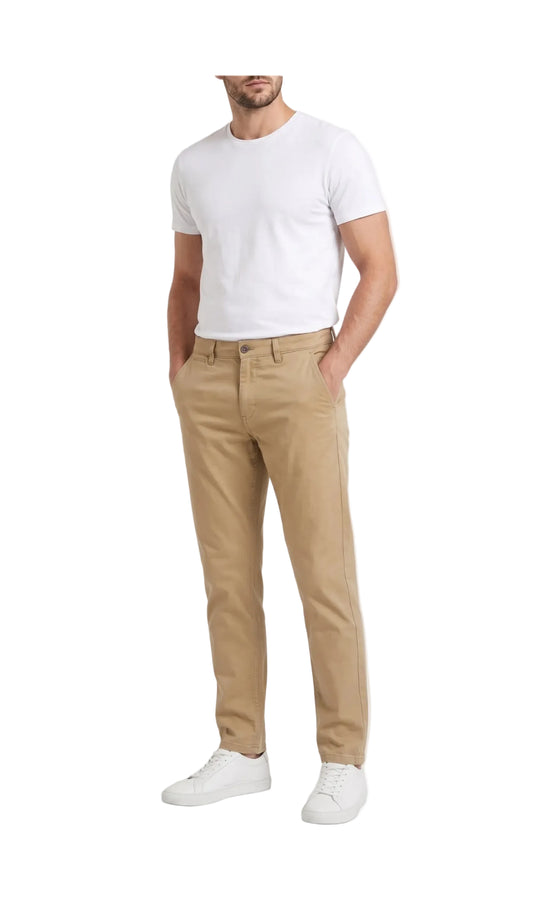 Front view of a man wearing gabardine 5-pocket pants by TREE in beige