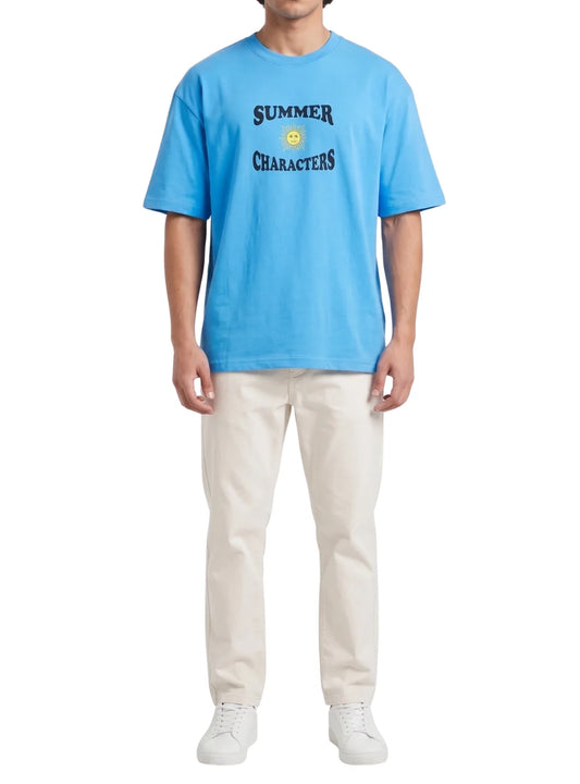 Front view of a man wearing a turquoise printed oversize 100% cotton t-shirt by TREE