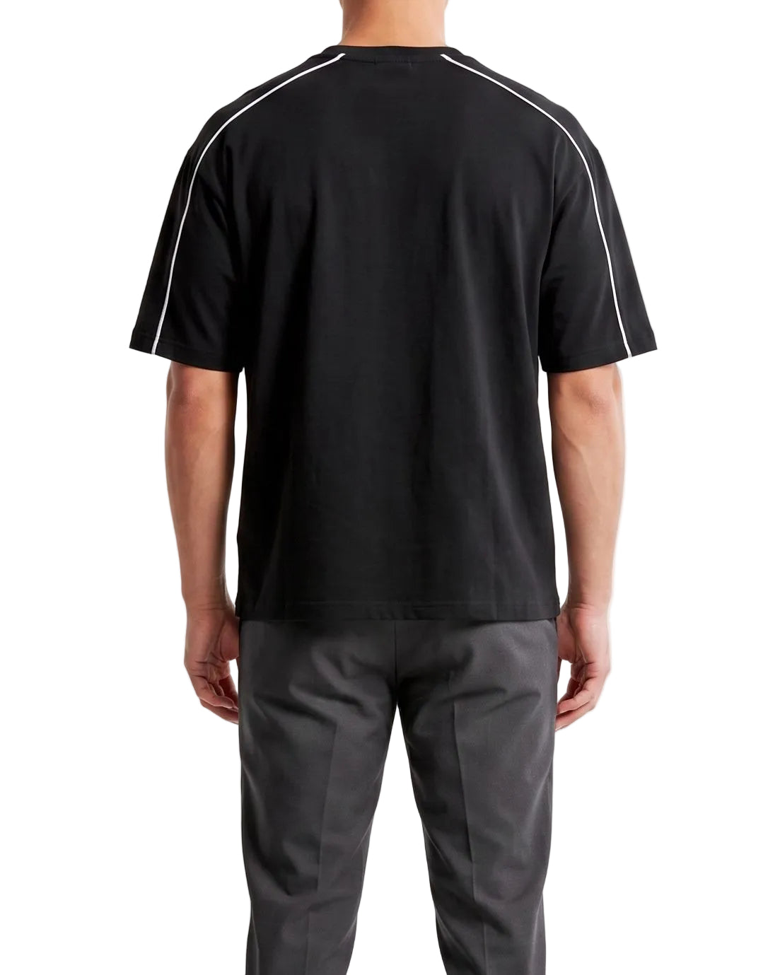 Back view of a men's oversized black t-shirt highlighting the white piping design across the shoulders.
