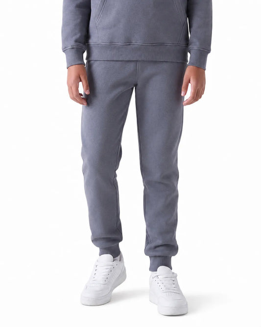 Front view of girls' milton grey sweatpants (65% cotton & 35% polyester) paired with a matching hoodie by TREE.