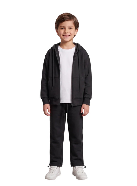 Full length view of a boy wearing matching black summer milton sweatpants and hoodie jacket by TREE
