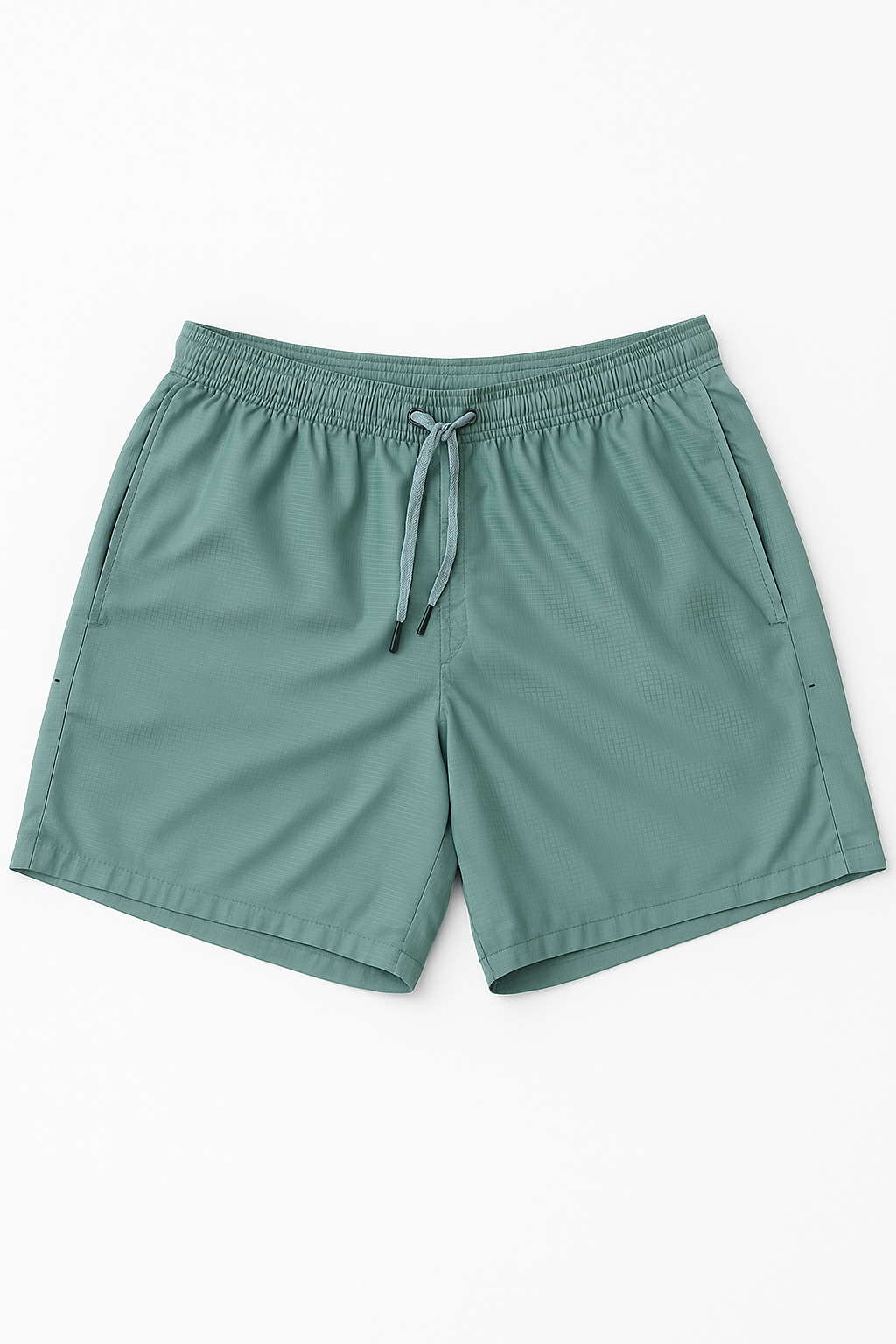 Green shorts with a drawstring on a white background