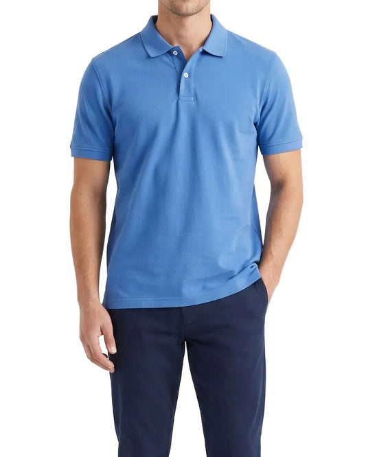 Front view of a man wearing a blue textured piqué premium polo shirt featuring a regular fit by TREE.