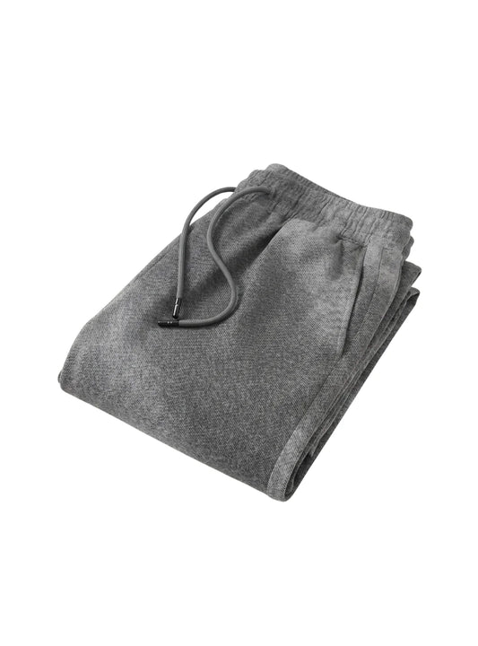 Folded men's casual grey textured shorts.
