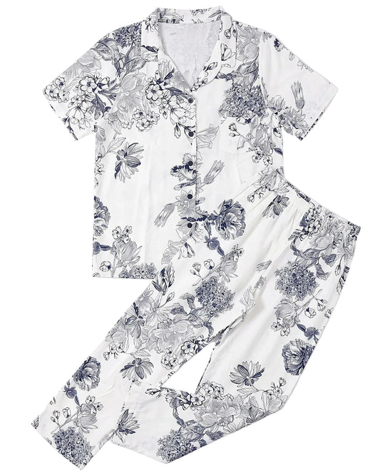Front view of a women's 100% viscose pajama set featuring a navy floral print in a relaxed fit by TREE.