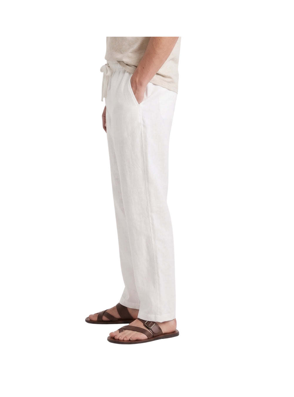 Front view of a man wearing white linen drawstring pants by TREE