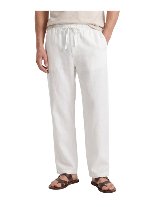 Front view of a man wearing white linen drawstring pants by TREE