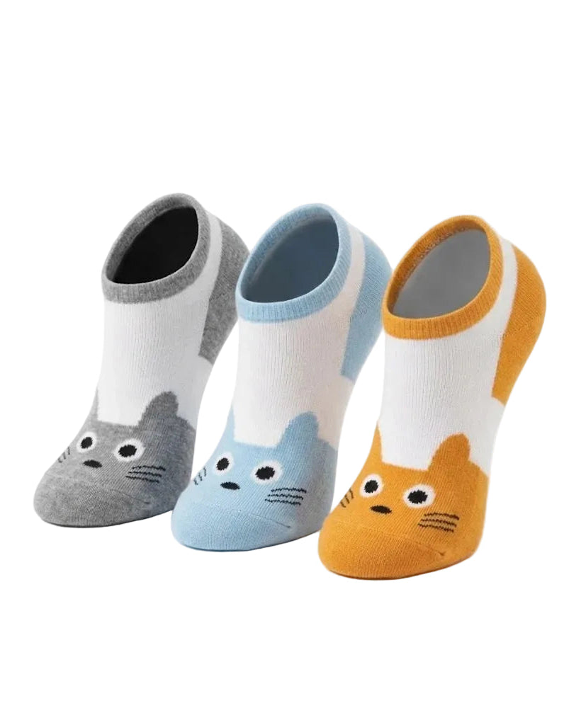 Three low-cut ankle socks with cartoon cat face designs, shown in gray, light blue, and mustard yellow on a plain white background.