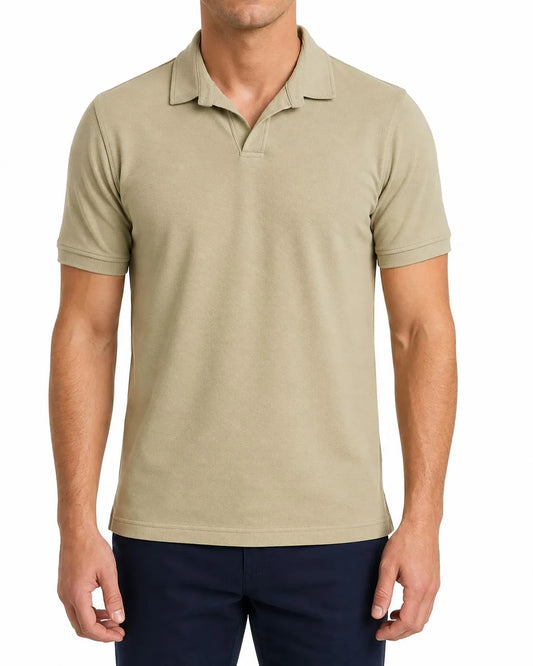 Front view of a man wearing a beige piqué polo shirt featuring a regular fit by TREE.