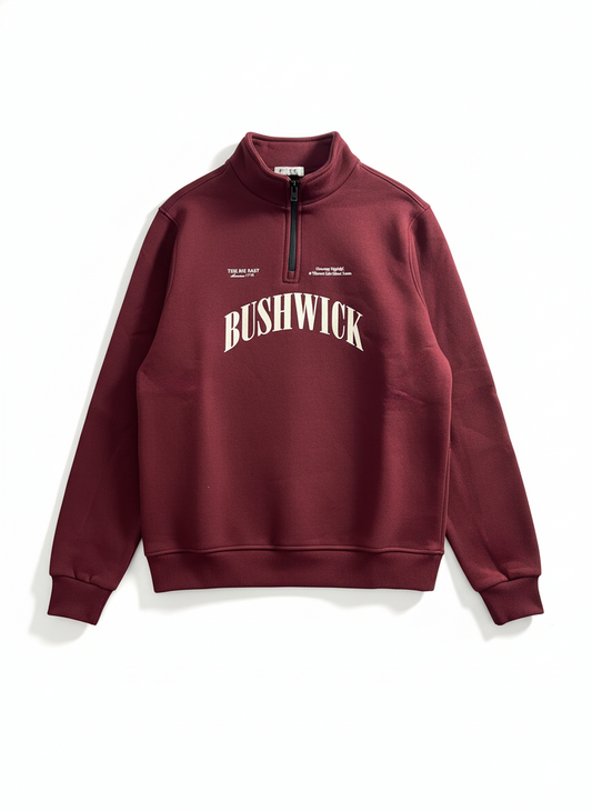 Maroon sweatshirt with 'BUSHWICK' text on a white background