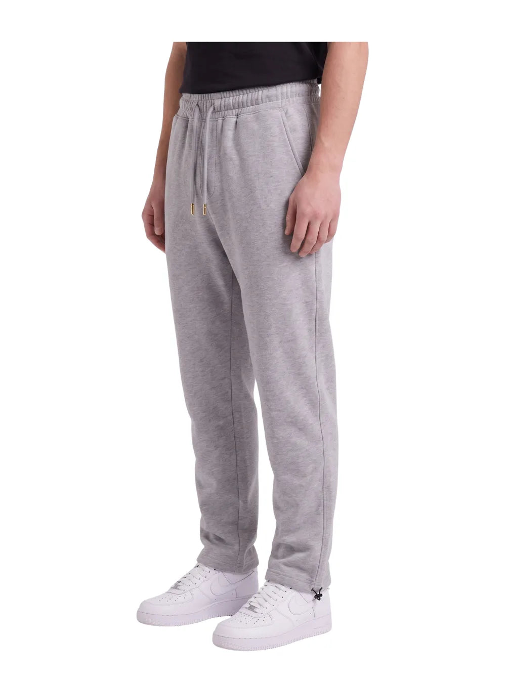 Front view of a man wearing wide-leg sweatpants in gray by TREE.