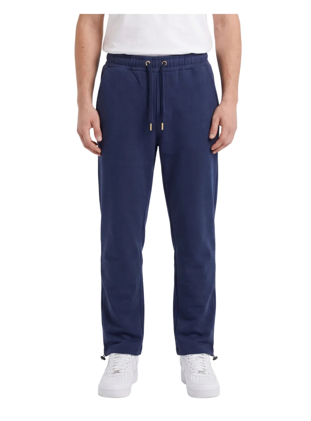 Front view of a man wearing wide-leg sweatpants in navy by TREE