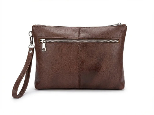 A brown faux-leather clutch bag with a wristlet strap and a horizontal zippered pocket on the front, shown against a plain white background.