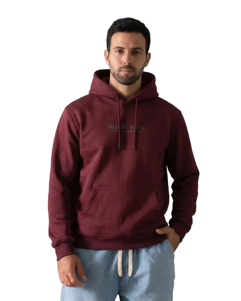A man wearing a Burgundy hoodie with 'MIDNIGHT WINTER' printed in black on the chest, paired with light blue sweatpants, against a plain white background.
