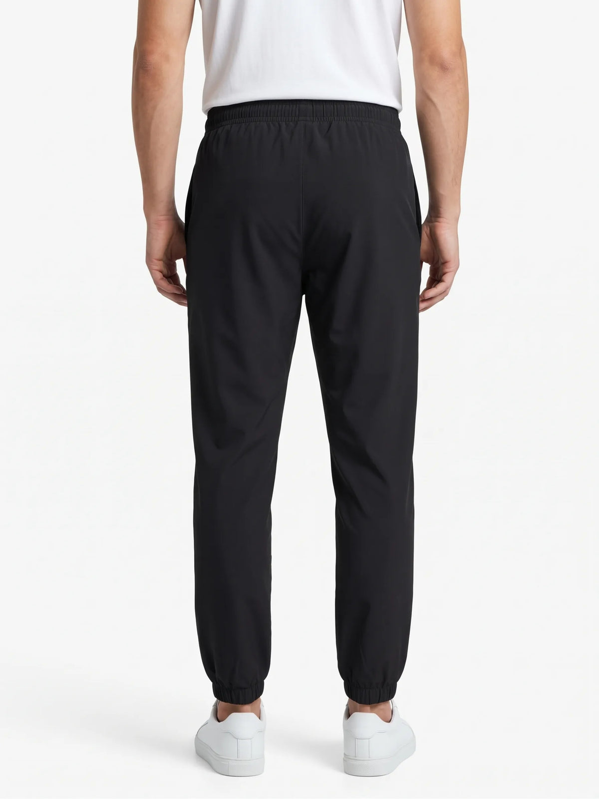 Close-up fabric texture and waistband details of men's black polyester sweatpants from TREE
