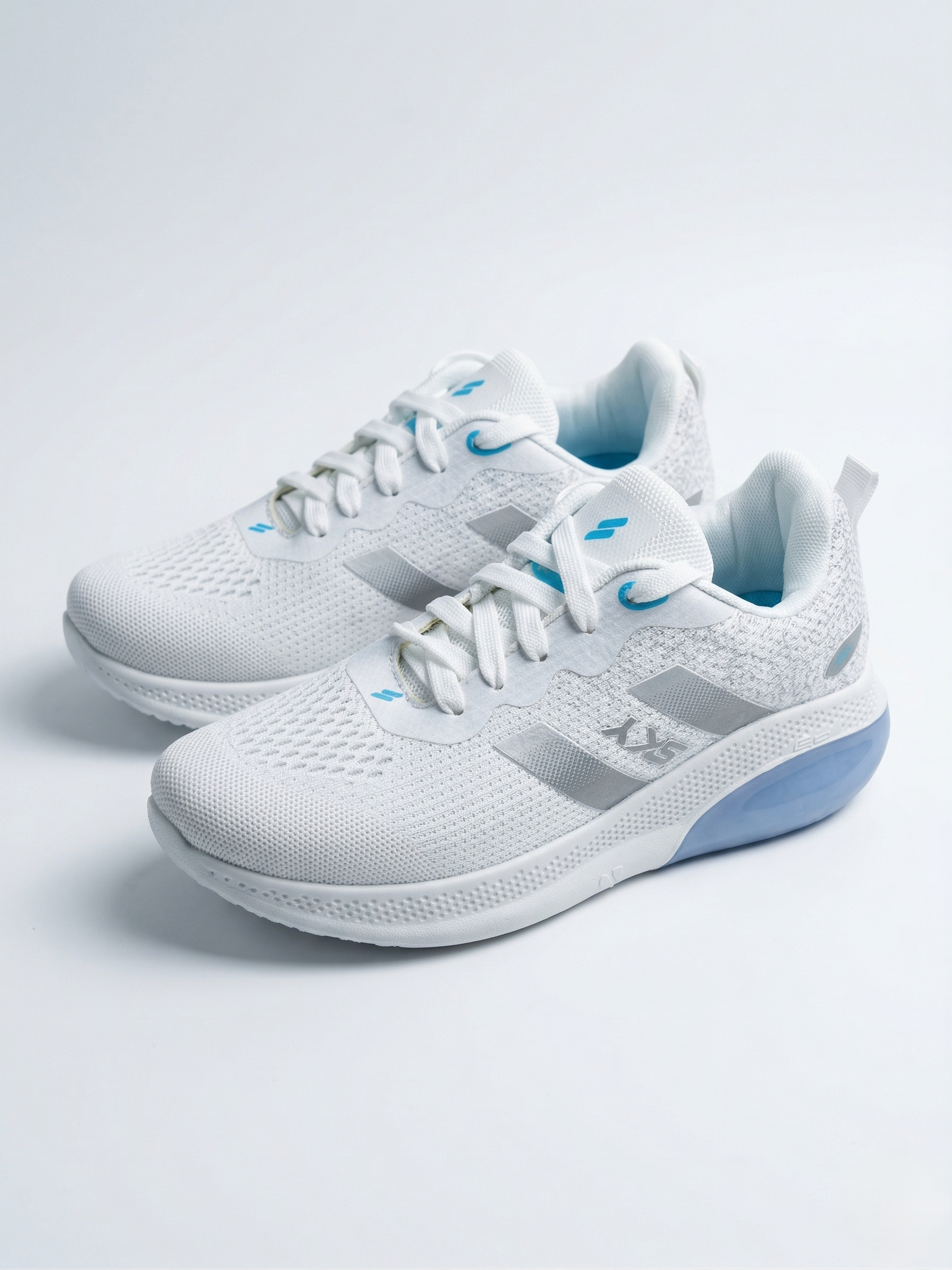 White running shoes with blue accents on a light gray background