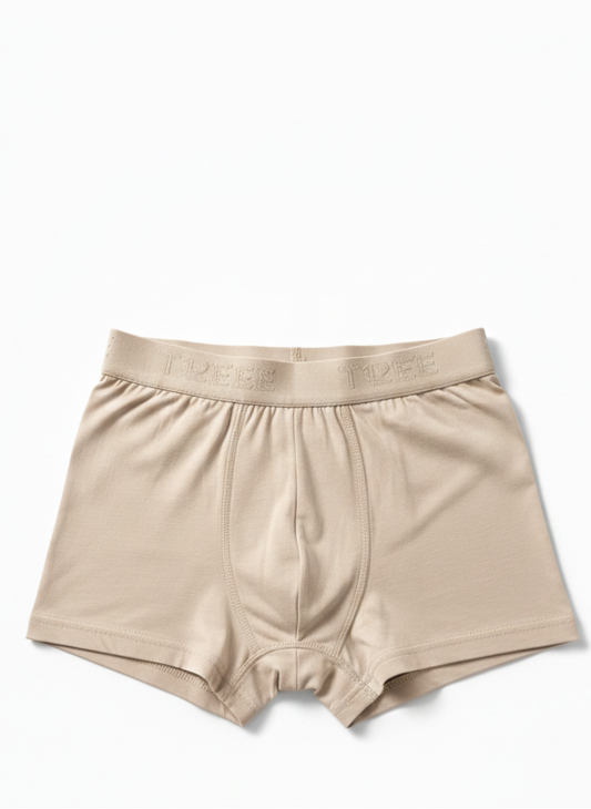 Beige boxer briefs on a white background