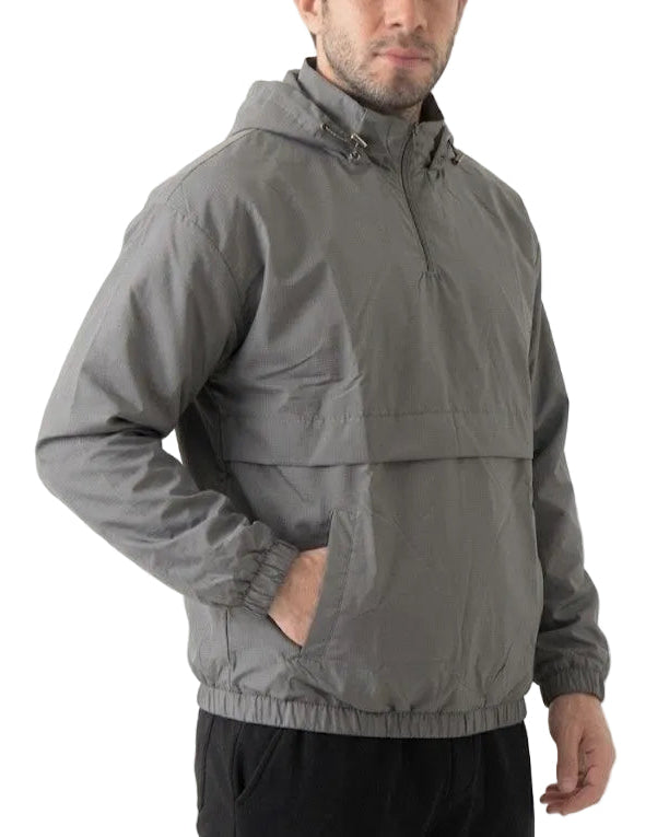 A man wearing a gray hooded lightweight jacket with a half-zip front and elastic cuffs, shown from the chest down against a plain white background.