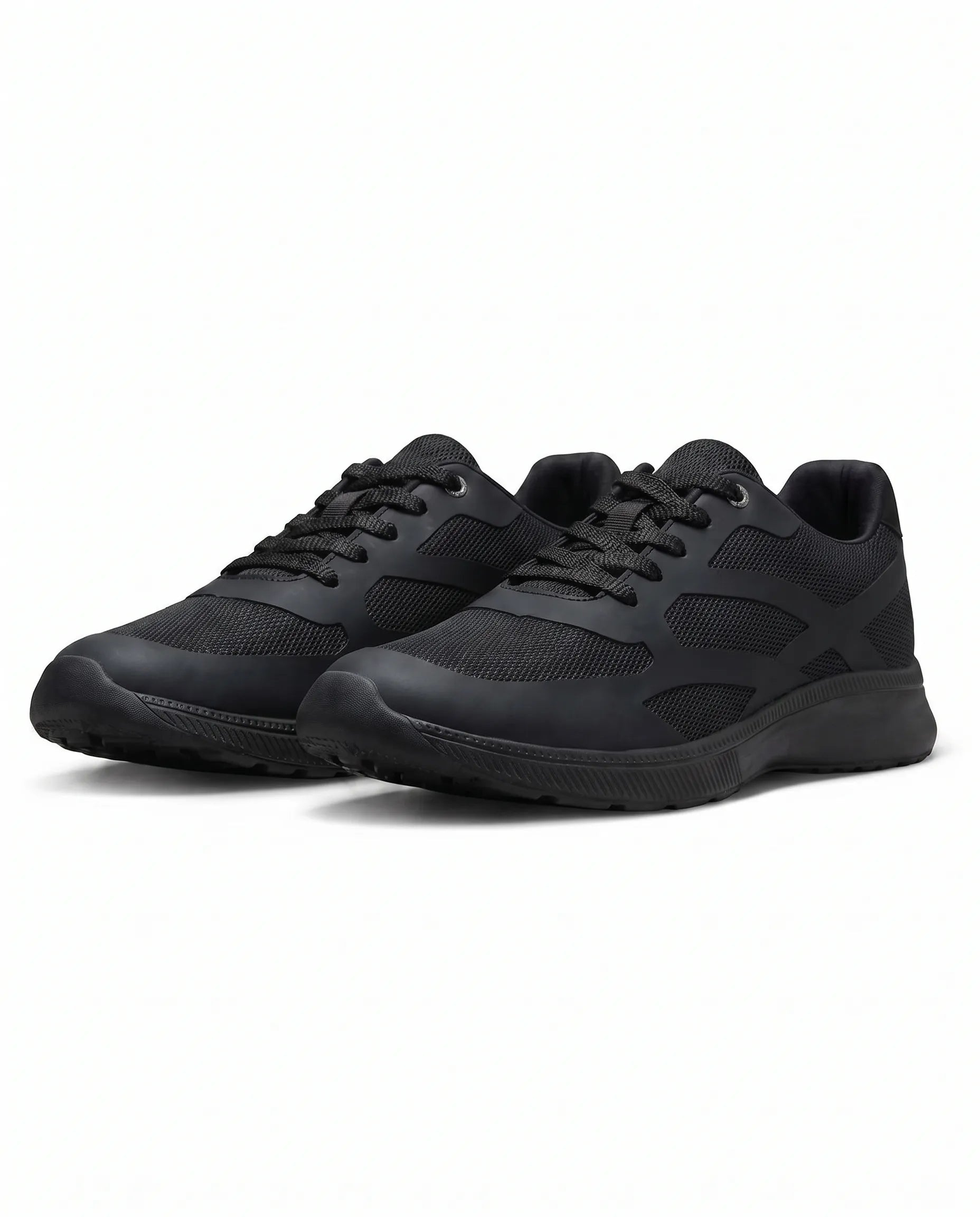 Youth solid black athletic sneakers with visible texture and mesh details from TREE