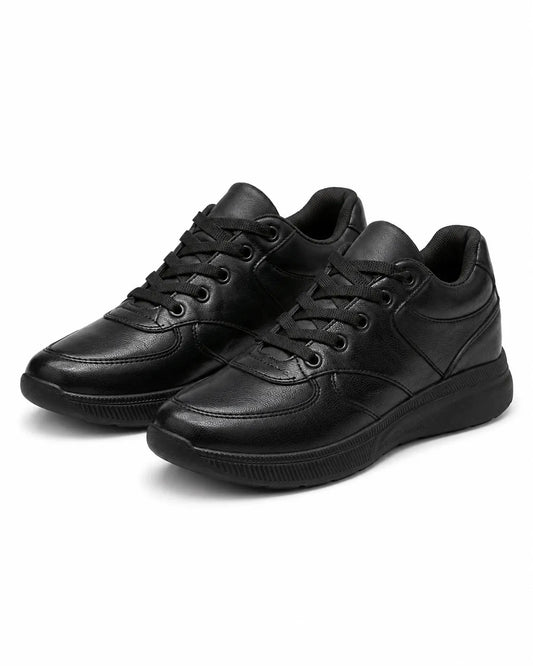 Side profile of TREE's black casual youth sneakers showing panel stitching and sole details