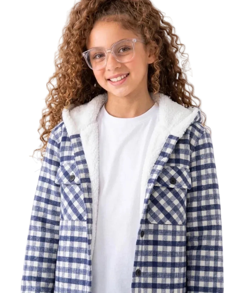 A young girl with curly brown hair and clear eyeglasses is wearing a blue and white gingham overshirt with a white sherpa-lined hood over a white t-shirt, photographed against a solid white background.