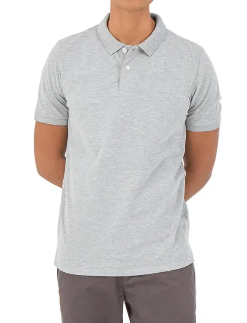 Front view of a man wearing a light grey piqué polo shirt featuring a regular fit by TREE.