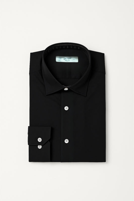 Folded black dress shirt on a light gray background