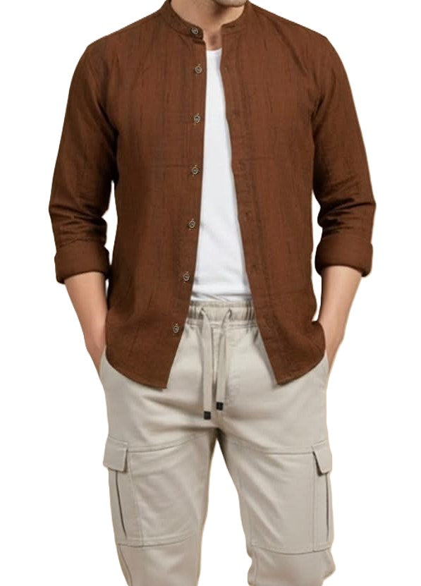 Man wearing a brown button-up shirt over a white t-shirt and beige cargo pants on a white background