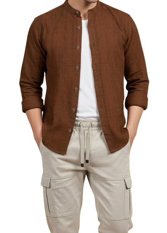 Man wearing a brown button-up shirt over a white t-shirt and beige cargo pants on a white background