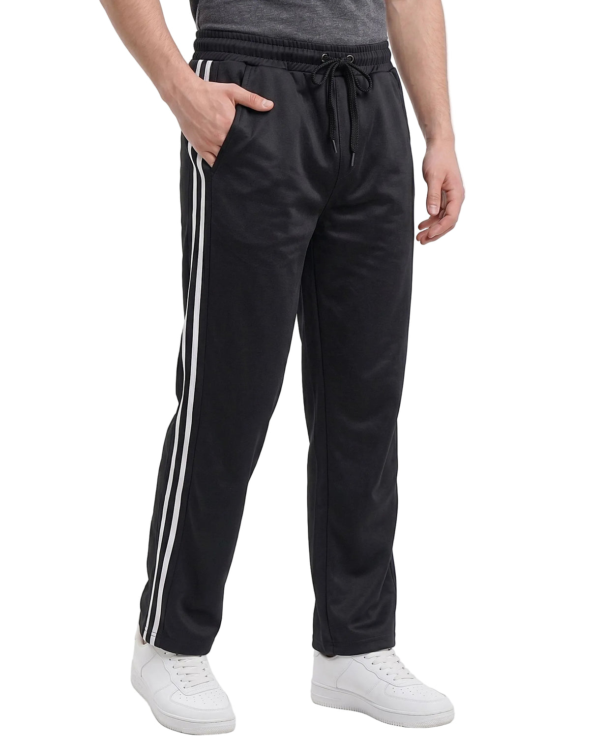 Black track pants with white stripes on a white background