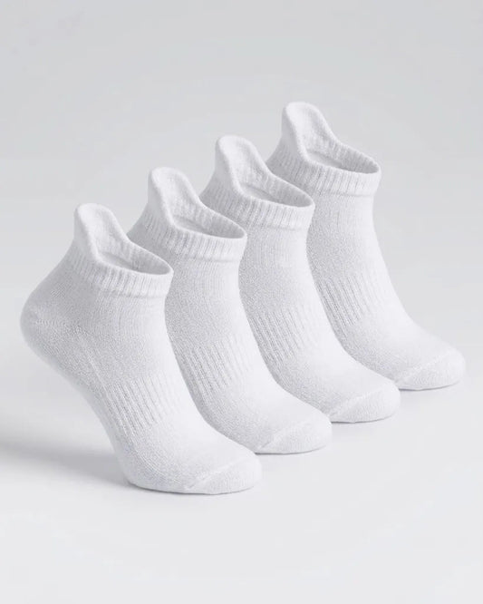 Four pairs of white low-cut ankle socks arranged in a row on a light gray studio background.